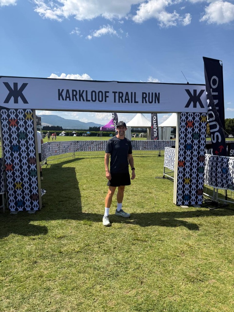 Jevon Coffin-Grey under the Karkloof Trail Run arch
